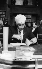 Photo of a Sikh student studying in the library