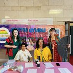 Image taken at Glitter Pride 2024, Jien Teh, Shana Parvin, Numair Masud and Mica Soft seated at table.