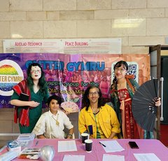 Image taken at Glitter Pride 2024, Jien Teh, Shana Parvin, Numair Masud and Mica Soft seated at table.