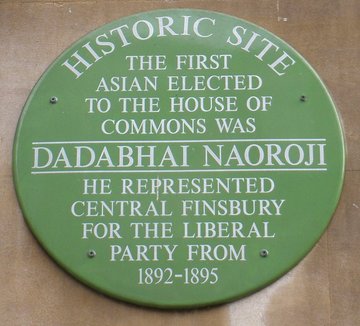 Green plaque commemorating the election of Dadabhai Naoroji to the House of Commons