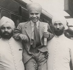 Photo of Sabu and his bodyguards leaving for New York