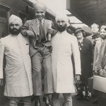 Photo of Sabu and his bodyguards leaving for New York