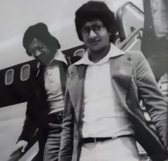 Vijay Parmar and friend disembarking a plane, 1976.