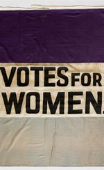 Suffragette banner, saying 'Votes for Women' in capital letters