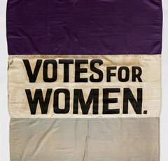 Suffragette banner, saying 'Votes for Women' in capital letters
